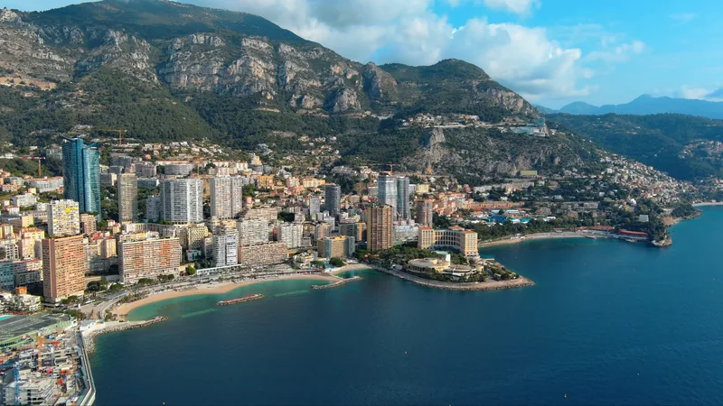 Aerial view of Monaco coastline with Larvotto beach and Tour Odéon